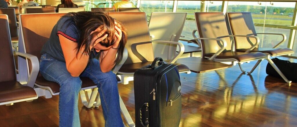 Depressed woman awaiting for plane 1024x790